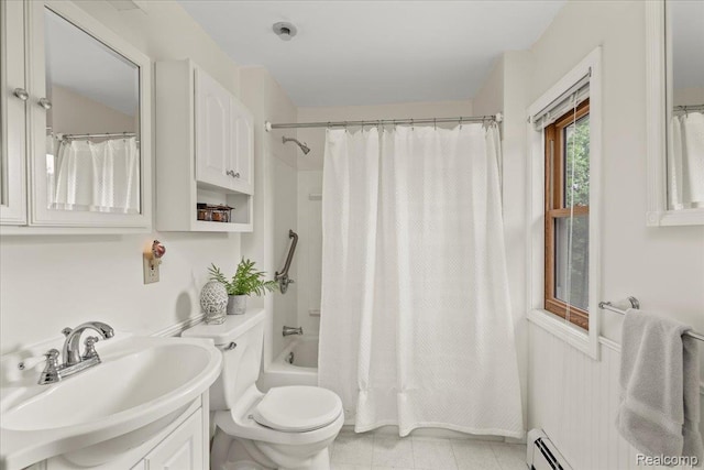 91 Dennison St, Oxford, MI 48371 - full bath with toilet, vanity, shower / bath combo, and baseboard heating