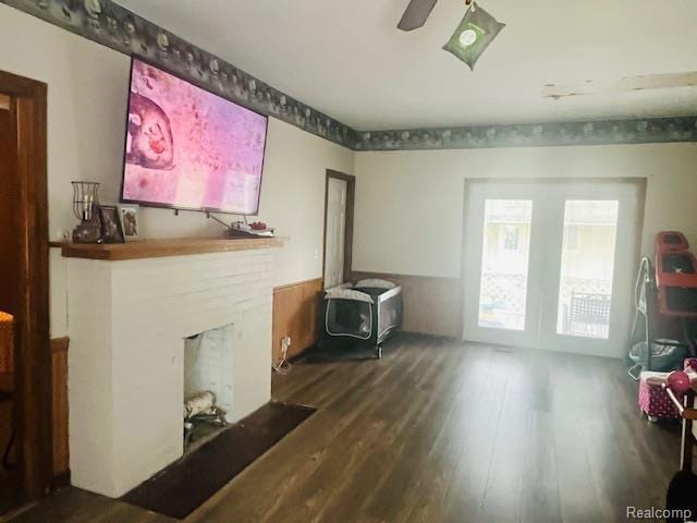 203 S Main St, Capac, MI 48014 - living area with wood finished floors and a fireplace