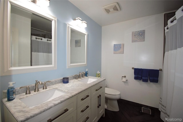 313 Janet Ln, Almont, MI 48003 - bathroom with double vanity, wood finished floors, toilet, and curtained shower