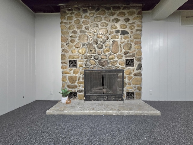 1658 Joslyn Rd, Muskegon, MI 49445 - detailed view of carpet, a stone fireplace, and wood walls