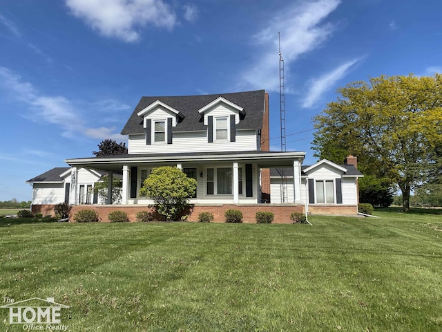 2437 S State Rd, Corunna, MI 48817 - view of front of home with brick siding, a front yard, covered porch, and roof with shingles