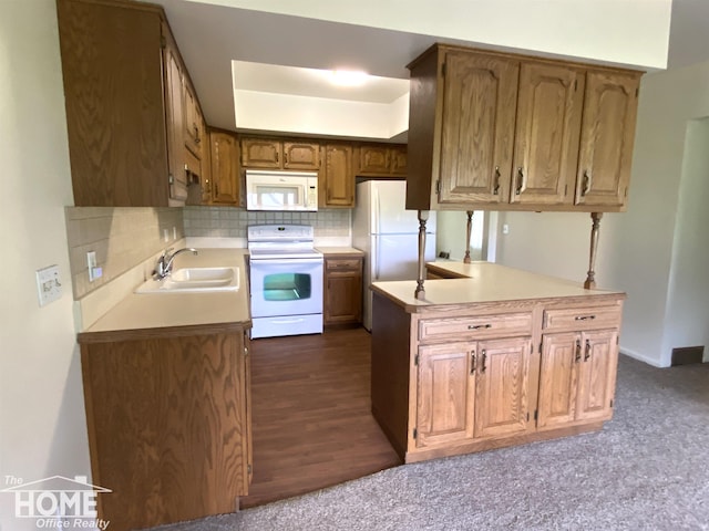 2437 S State Rd, Corunna, MI 48817 - kitchen with white appliances, a sink, light countertops, backsplash, and brown cabinetry