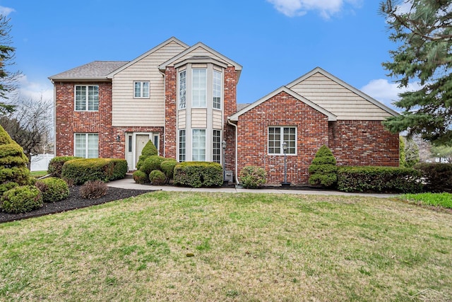 4600 S White Trillium Dr, Saginaw, MI 48603 - traditional-style house with a front lawn and brick siding