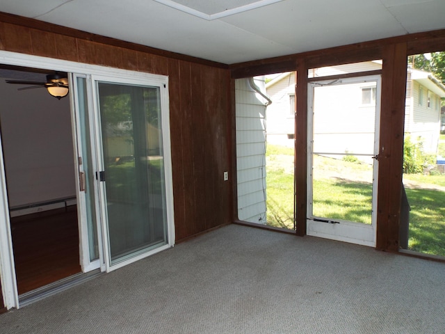 407 Doty St, Leslie, MI 49251 - unfurnished sunroom featuring a baseboard heating unit and a ceiling fan