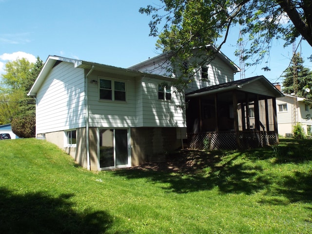 407 Doty St, Leslie, MI 49251 - back of property with a sunroom and a yard