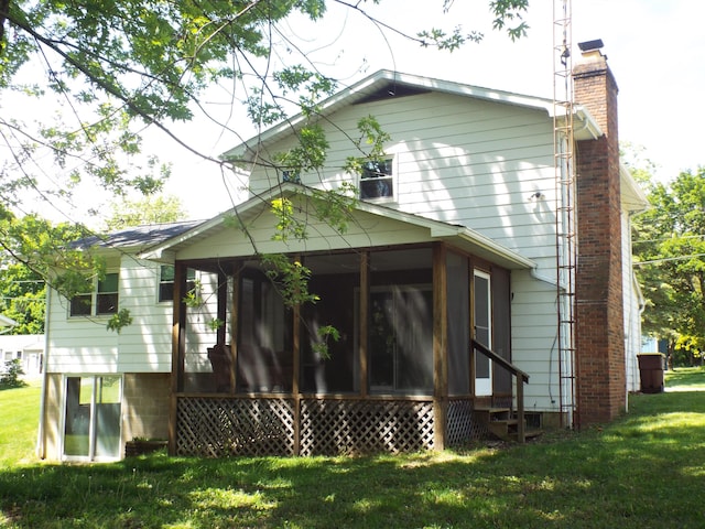 407 Doty St, Leslie, MI 49251 - rear view of property with a sunroom, a chimney, and a yard