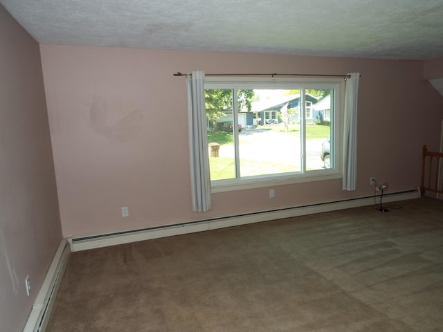 407 Doty St, Leslie, MI 49251 - carpeted spare room with a textured ceiling, baseboard heating, and baseboards
