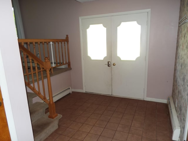 407 Doty St, Leslie, MI 49251 - entryway featuring a baseboard heating unit, stairway, french doors, and baseboards