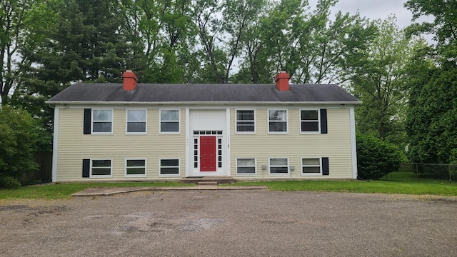 1828-1830 Winton, Kalamazoo, MI 49001 - bi-level home with a chimney and view of scattered trees