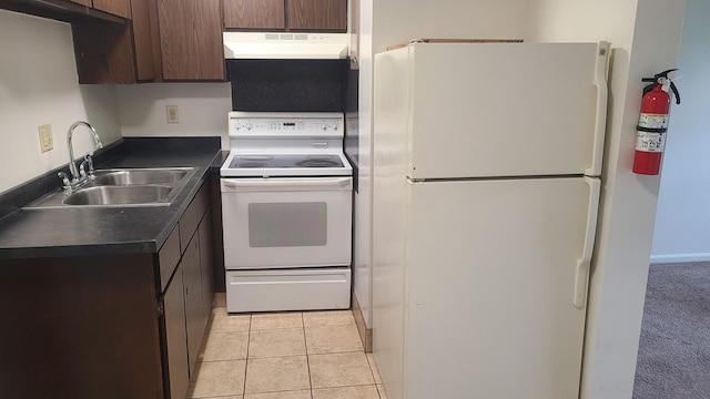 1828-1830 Winton, Kalamazoo, MI 49001 - kitchen featuring white appliances, range hood, dark countertops, a sink, and dark brown cabinets