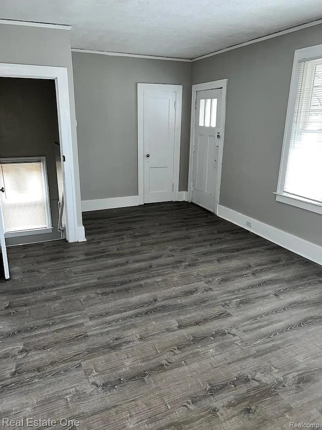 2332 Clements St, Detroit, MI 48238 - foyer featuring dark wood-style flooring, crown molding, and baseboards