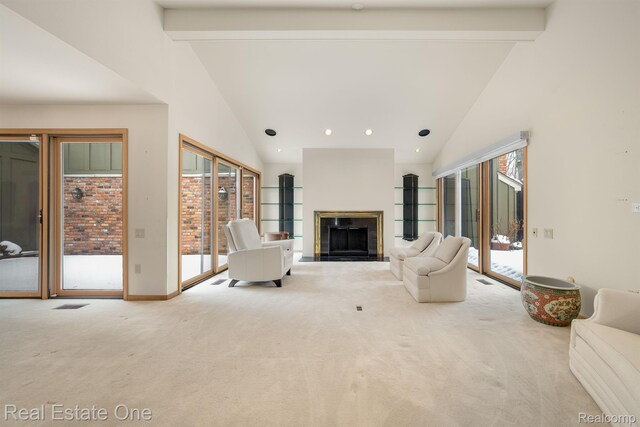 4017 Hidden Woods, Bloomfield Hills, MI 48301 - carpeted living room featuring high vaulted ceiling, beamed ceiling, a fireplace with raised hearth, and baseboards