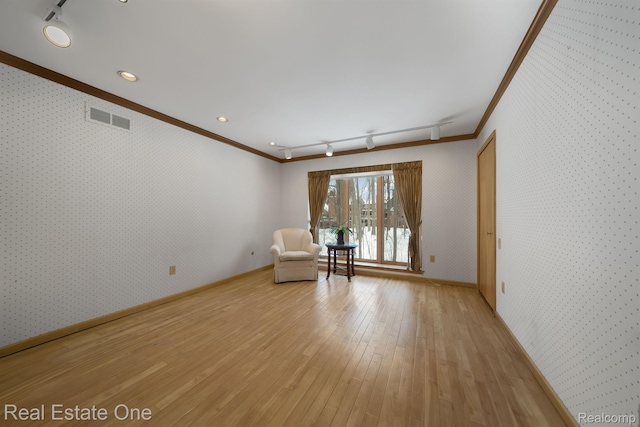 4017 Hidden Woods, Bloomfield Hills, MI 48301 - unfurnished room with crown molding, track lighting, wallpapered walls, light wood-style flooring, and baseboards