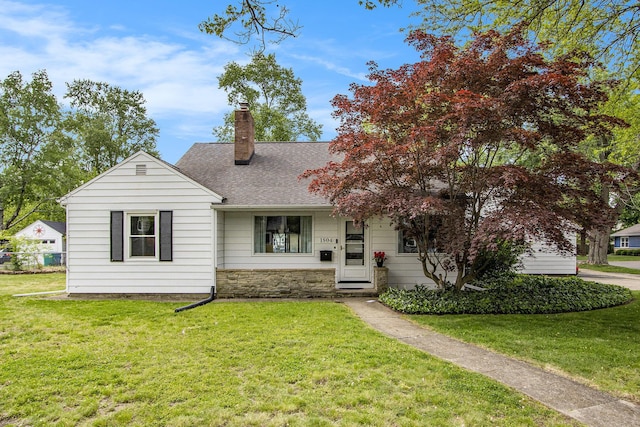 1804 Lakeway Ave, Kalamazoo, MI 49001 - view of front of property with a chimney, stone siding, a front yard, and roof with shingles