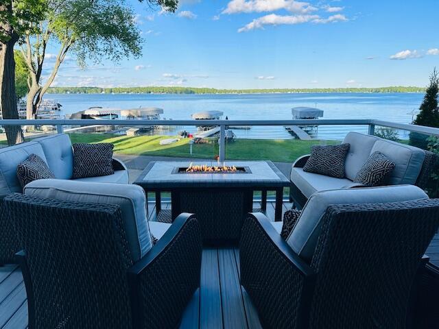 9393 Fraulin Dr, Richland, MI 49083 - view of patio / terrace featuring an outdoor living space with a fire pit and a water view