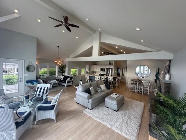 9393 Fraulin Dr, Richland, MI 49083 - living area featuring ceiling fan, beam ceiling, high vaulted ceiling, wood finished floors, and recessed lighting