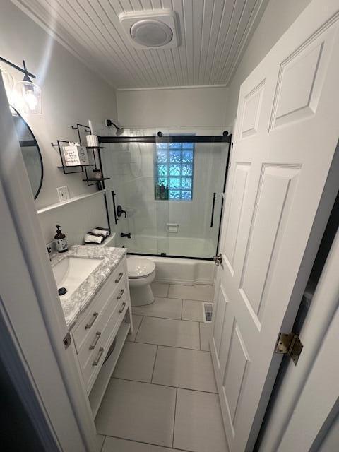 9393 Fraulin Dr, Richland, MI 49083 - full bathroom with vanity, toilet, shower / bath combination with glass door, tile patterned floors, and wood ceiling