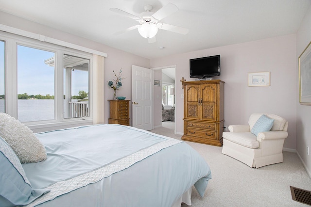 714 N Hawley Dr, Coldwater, MI 49036 - carpeted bedroom featuring baseboards, ceiling fan, and access to exterior