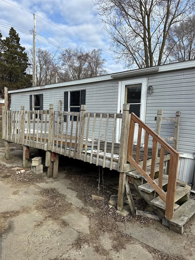 2445 E Grand River Rd, Lot, Williamston, MI 48895 - rear view of house featuring a deck