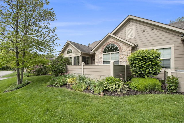 933 Bridge Crest Dr SE, Ada, MI 49301 - view of property exterior with stone siding