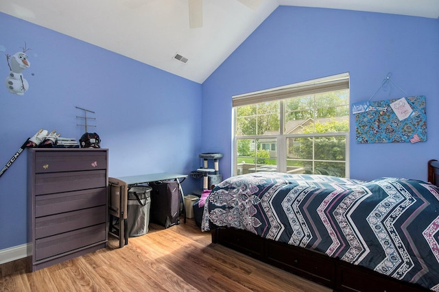 933 Bridge Crest Dr SE, Ada, MI 49301 - bedroom with vaulted ceiling, wood finished floors, and a ceiling fan