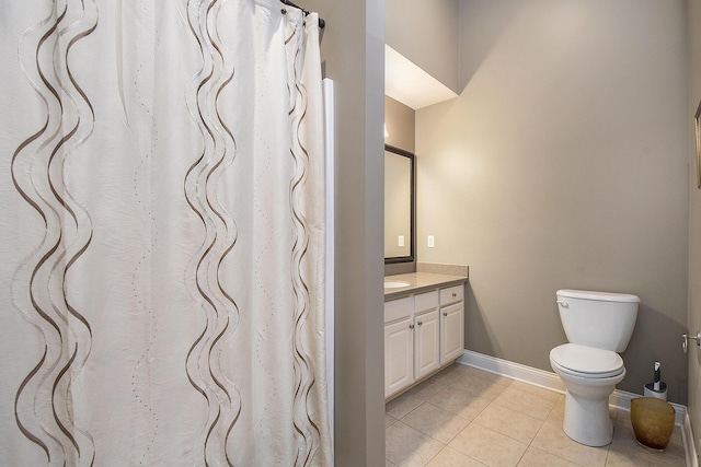 933 Bridge Crest Dr SE, Ada, MI 49301 - full bath with vanity, tile patterned floors, toilet, and baseboards
