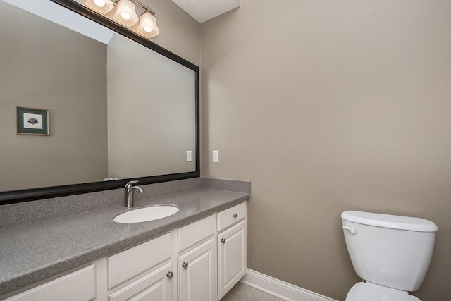 933 Bridge Crest Dr SE, Ada, MI 49301 - bathroom with vanity, toilet, tile patterned flooring, and baseboards