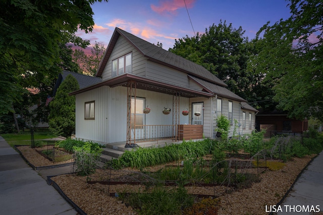1000 Garfield Ave NW, Grand Rapids, MI 49504 - bungalow-style house with covered porch and roof with shingles