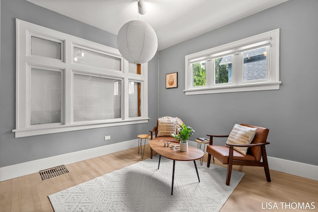 1000 Garfield Ave NW, Grand Rapids, MI 49504 - sitting room with baseboards and wood finished floors