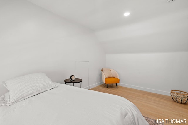 1000 Garfield Ave NW, Grand Rapids, MI 49504 - bedroom featuring vaulted ceiling, wood finished floors, and baseboards
