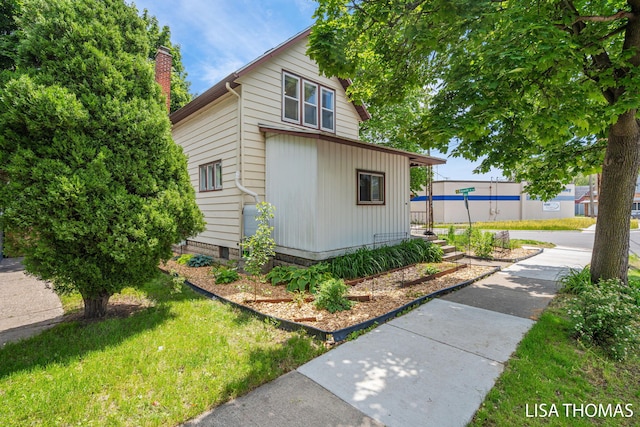 1000 Garfield Ave NW, Grand Rapids, MI 49504 - view of home's exterior with a chimney
