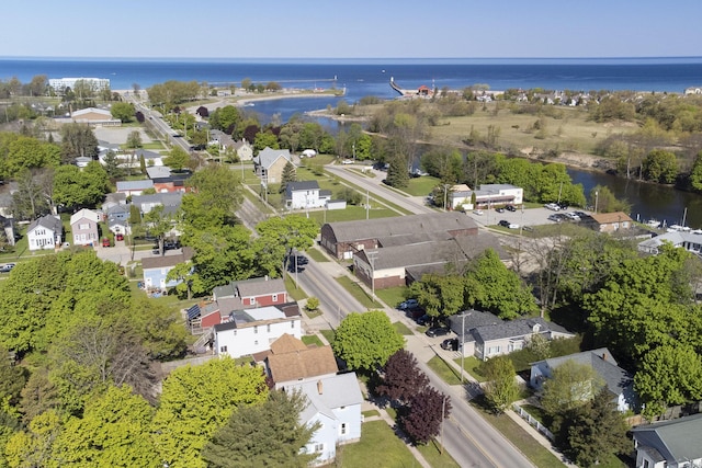 513 1st St, Manistee, MI 49660 - aerial overview of property's location featuring a nearby body of water and nearby suburban area