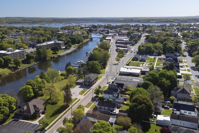 513 1st St, Manistee, MI 49660 - aerial overview of property's location with a nearby body of water and nearby suburban area