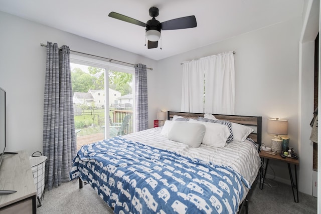 513 1st St, Manistee, MI 49660 - bedroom featuring carpet floors, ceiling fan, and access to exterior
