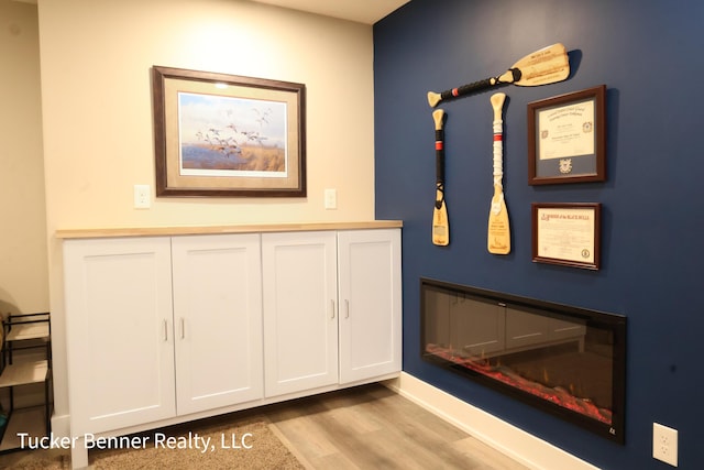 239 Monroe Ave, Muskegon, MI 49441 - detailed view of wood finished floors and baseboards