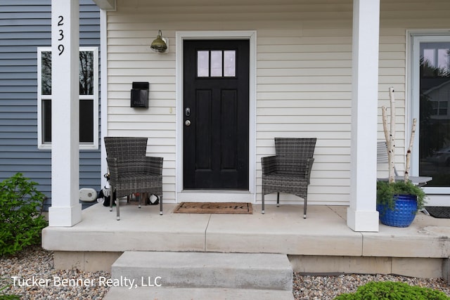 239 Monroe Ave, Muskegon, MI 49441 - property entrance with a porch