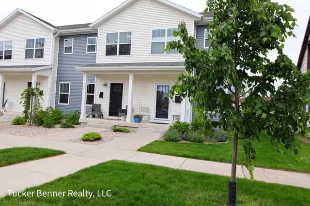 239 Monroe Ave, Muskegon, MI 49441 - view of property featuring a porch and a front lawn