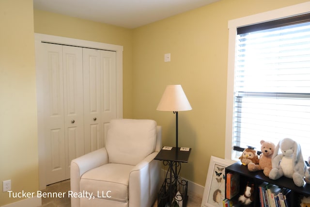 239 Monroe Ave, Muskegon, MI 49441 - living area featuring healthy amount of natural light and baseboards