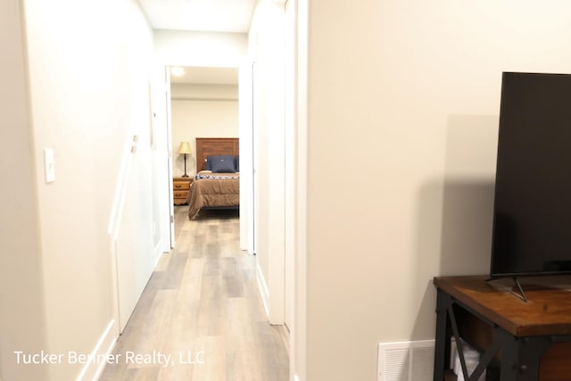 239 Monroe Ave, Muskegon, MI 49441 - corridor featuring light wood-style floors and baseboards