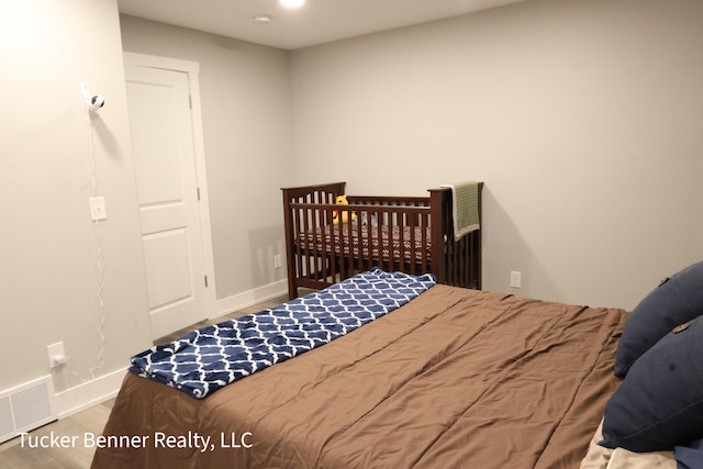 239 Monroe Ave, Muskegon, MI 49441 - bedroom with wood finished floors and baseboards