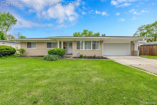 11030 Olive St, Warren, MI 48093 - ranch-style house featuring brick siding, a garage, and concrete driveway