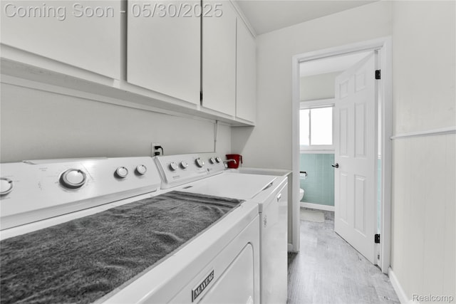 11030 Olive St, Warren, MI 48093 - washroom with washing machine and dryer, cabinet space, wainscoting, and light wood-type flooring