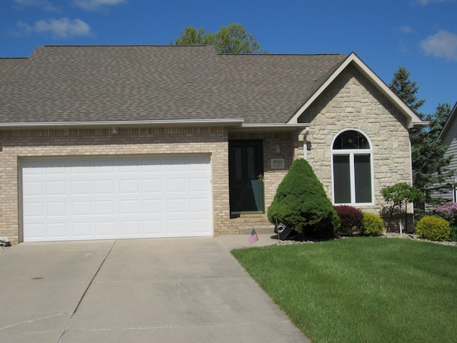 6044 Belmont Ct, Grand Blanc, MI 48439 - view of front of house with driveway, brick siding, a front yard, roof with shingles, and an attached garage
