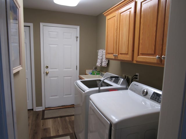 6044 Belmont Ct, Grand Blanc, MI 48439 - washroom with cabinet space, separate washer and dryer, and wood finished floors