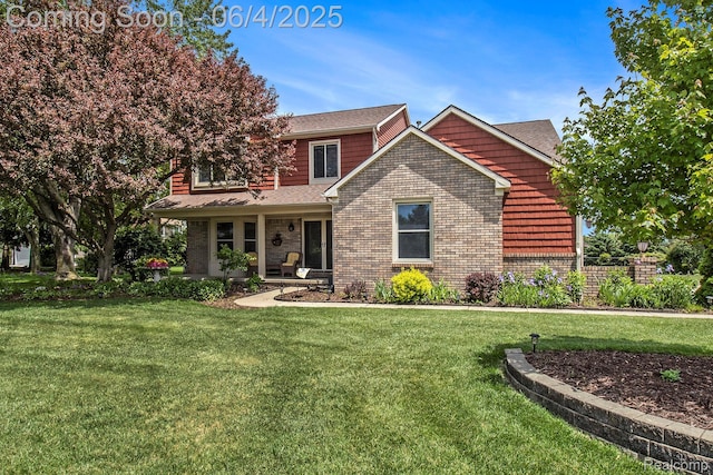 155 Woodridge Ct, Oxford, MI 48371 - view of front facade with a front yard, brick siding, and covered porch