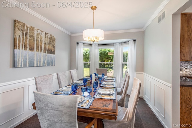 155 Woodridge Ct, Oxford, MI 48371 - carpeted dining room with crown molding, a decorative wall, wainscoting, and a chandelier