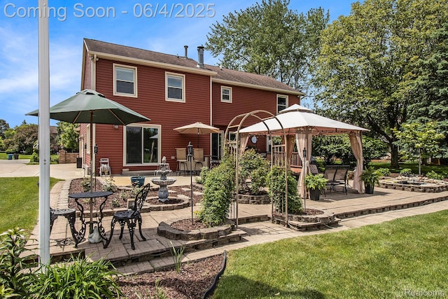 155 Woodridge Ct, Oxford, MI 48371 - rear view of house featuring a gazebo, a patio, and a lawn