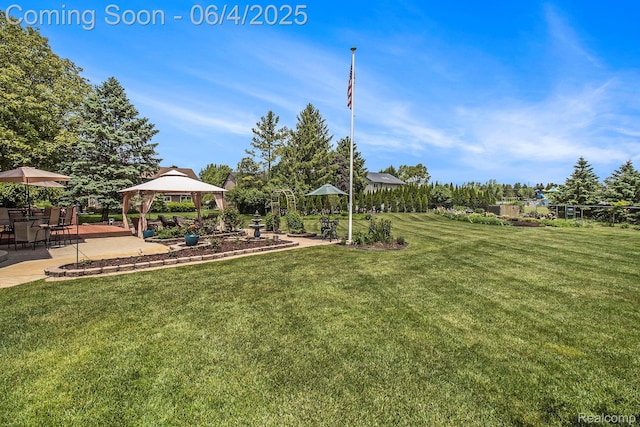 155 Woodridge Ct, Oxford, MI 48371 - view of grassy yard featuring a gazebo and a patio area
