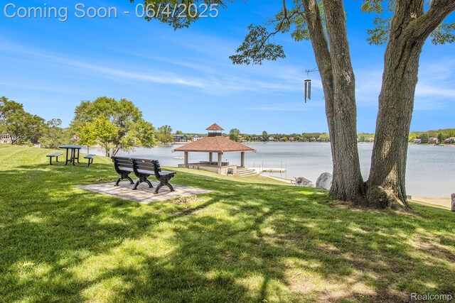 155 Woodridge Ct, Oxford, MI 48371 - view of green lawn featuring a gazebo and a water view