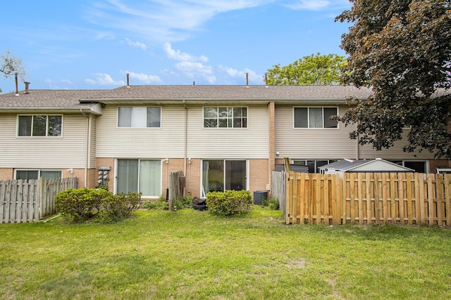 3407 Kenbrooke Ct, Kalamazoo, MI 49006 - rear view of house featuring brick siding and central air condition unit